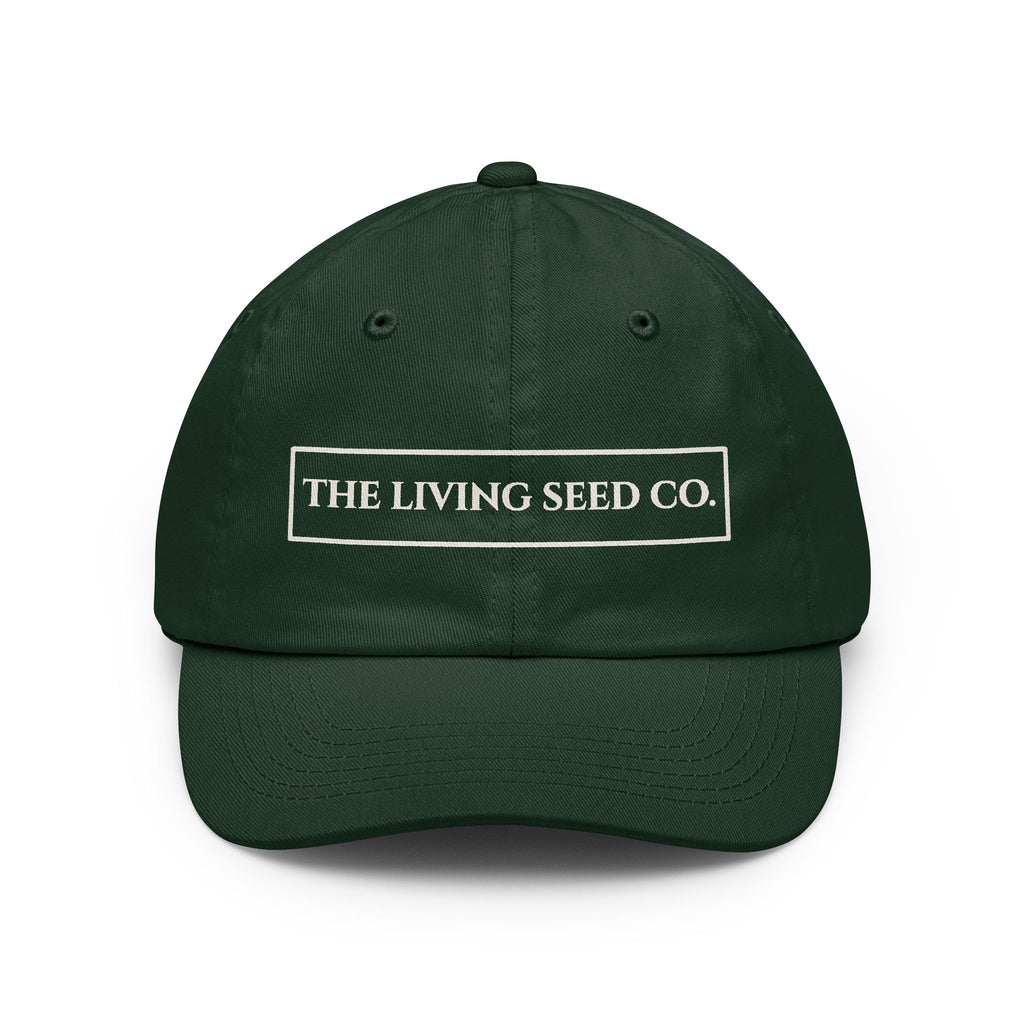 The Original Dad Hat in Forest Green featuring The Living Seed Co. embroidered boxed wordmark on a relaxed unstructured bio-washed cotton dad hat