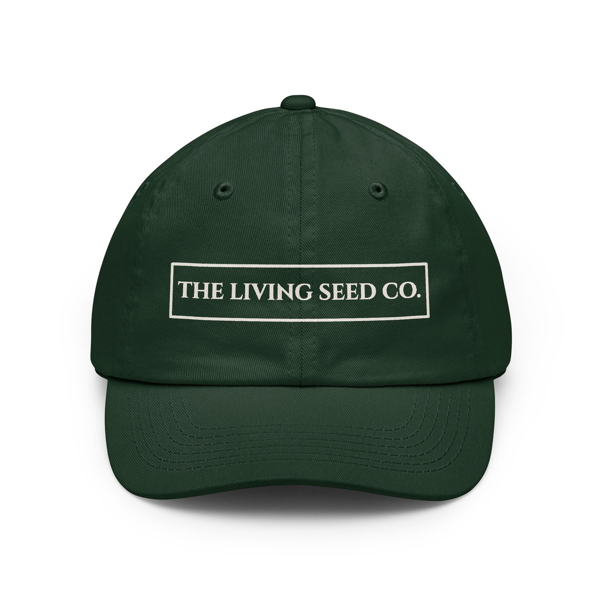 The Original Dad Hat in Forest Green featuring The Living Seed Co. embroidered boxed wordmark on a relaxed unstructured bio-washed cotton dad hat