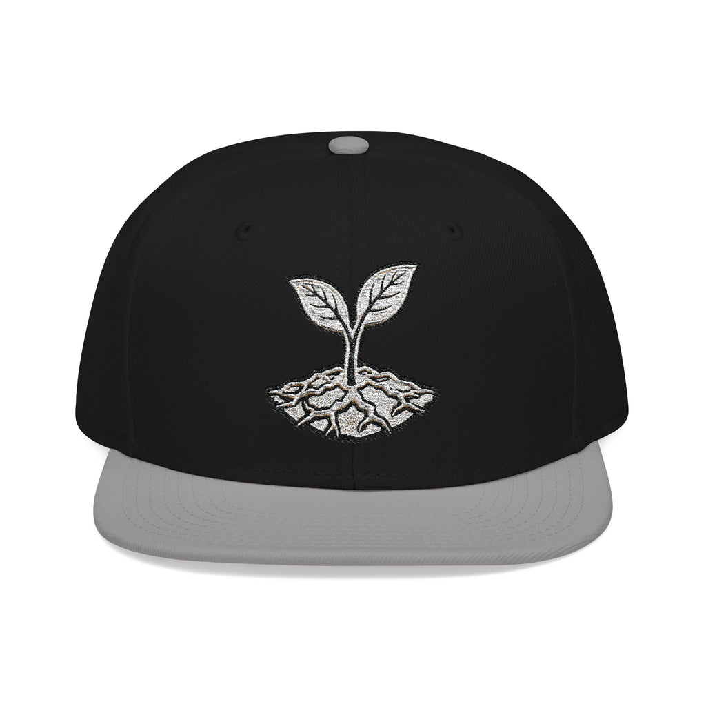 The Living Seed Co. Original Snapback in gray and black — front view showing embroidered seedling mark, Otto Cap flat bill