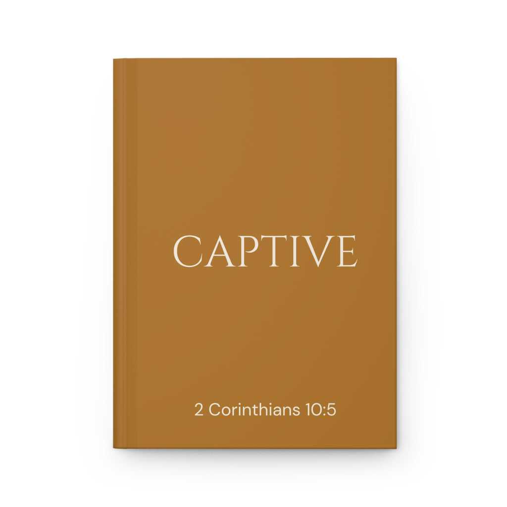 Scripture Series CAPTIVE Journal in Harvest Gold — flat mockup — harvest gold hardcover journal with CAPTIVE in parchment lettering and 2 Corinthians 10:5 reference.