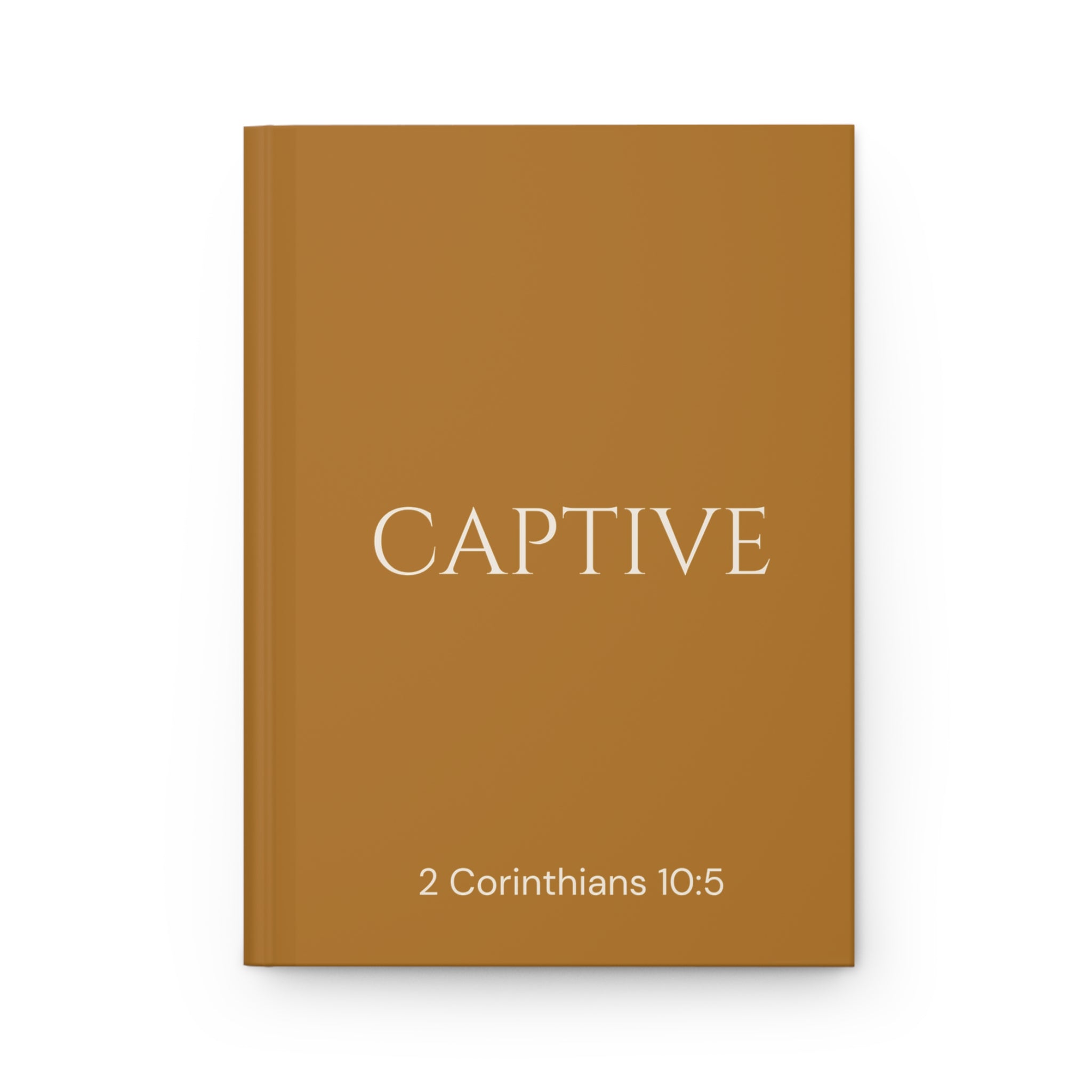 Scripture Series CAPTIVE Journal in Harvest Gold — flat mockup — harvest gold hardcover journal with CAPTIVE in parchment lettering and 2 Corinthians 10:5 reference.
