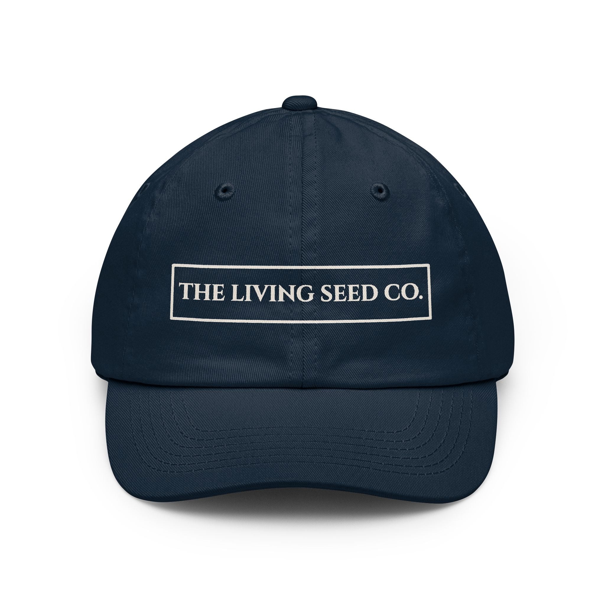 The Original Dad Hat in Navy featuring The Living Seed Co. embroidered boxed wordmark on a relaxed unstructured bio-washed cotton dad hat