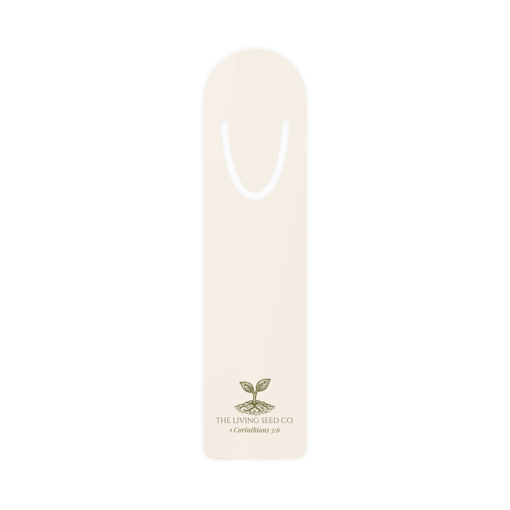 The Original Bookmark in Parchment — lightweight aluminum bookmark printed with The Living Seed Co. sprouting seed logo and 1 Corinthians 3:6