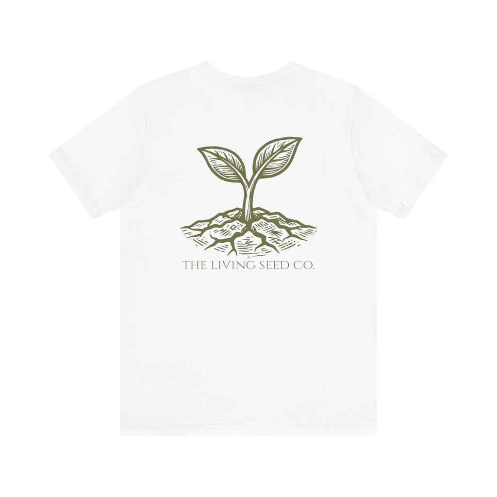 The Original Tee in White — back view flat mockup — white unisex t-shirt featuring The Living Seed Co. etching-style sprouting seed graphic in olive ink with wordmark below. Bella+Canvas 3001.