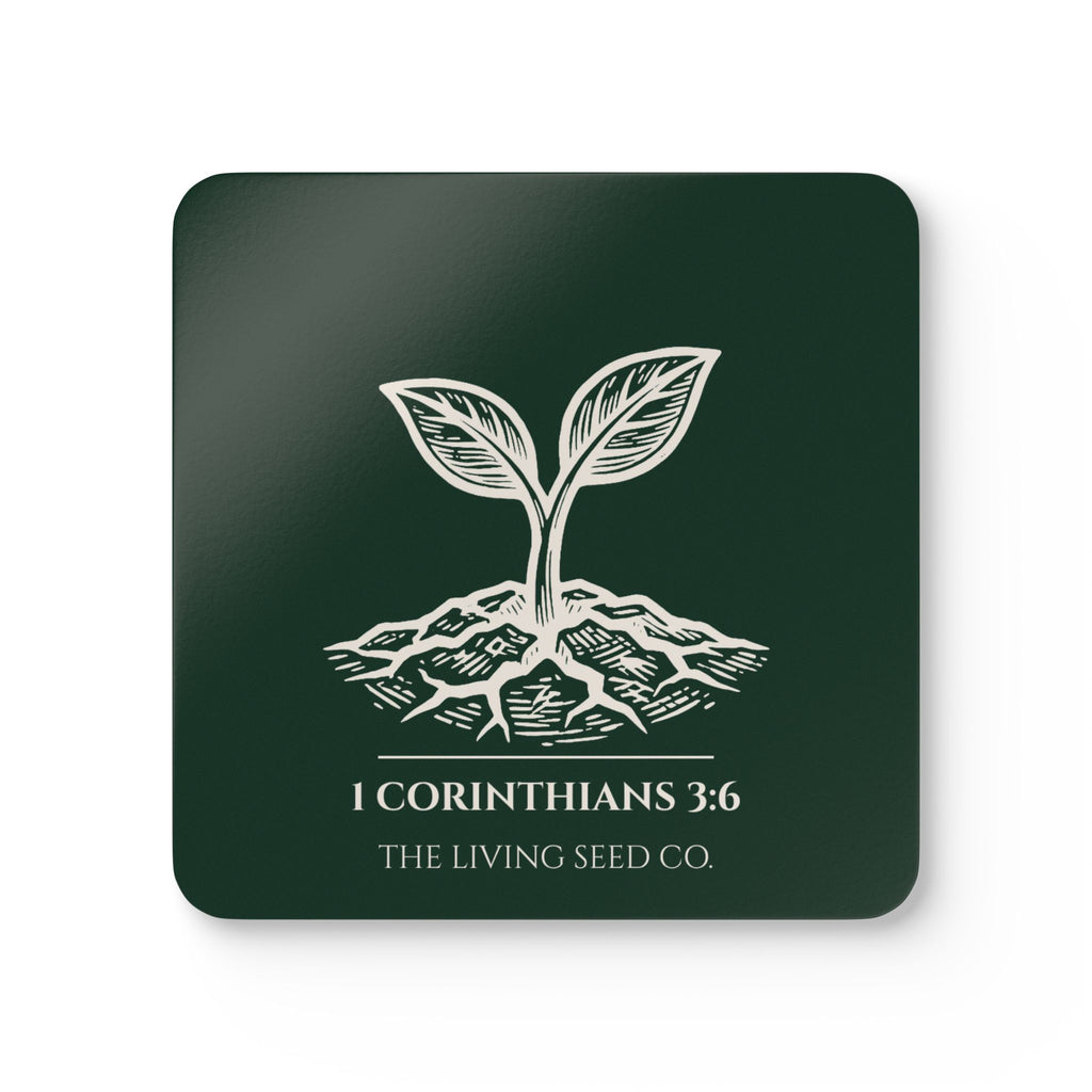 Forest Deep coaster with etching-style sprouting seed graphic, 1 Corinthians 3:6, and The Living Seed Co. wordmark on high-gloss MDF with cork back