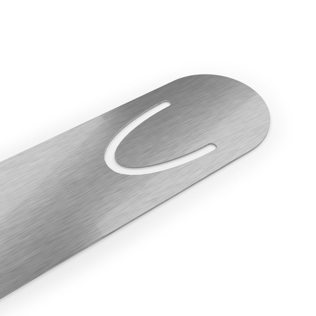 Side view of The Original Bookmark showing slim aluminum construction and top page-hold slot, The Living Seed Co. branded bookmark in Parchment