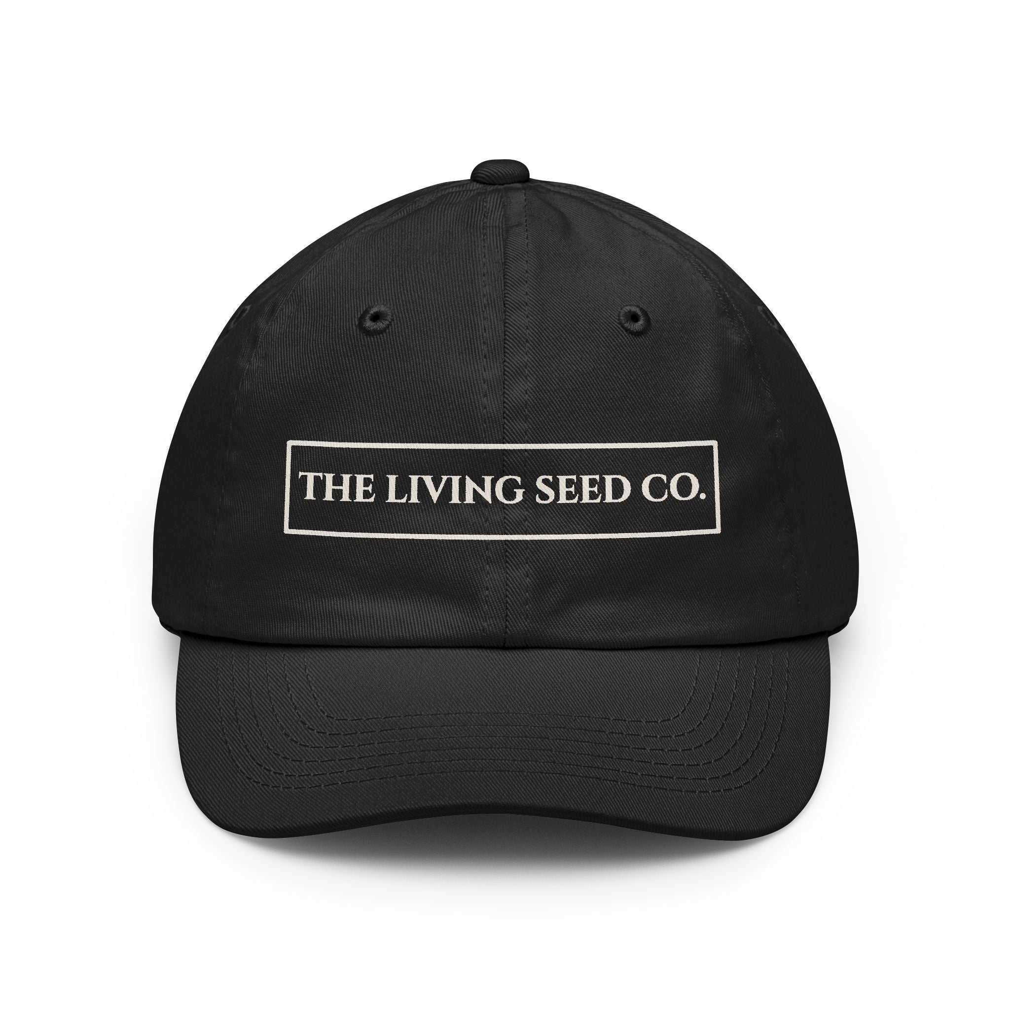 The Original Dad Hat in Black featuring The Living Seed Co. embroidered boxed wordmark on a relaxed unstructured bio-washed cotton dad hat
