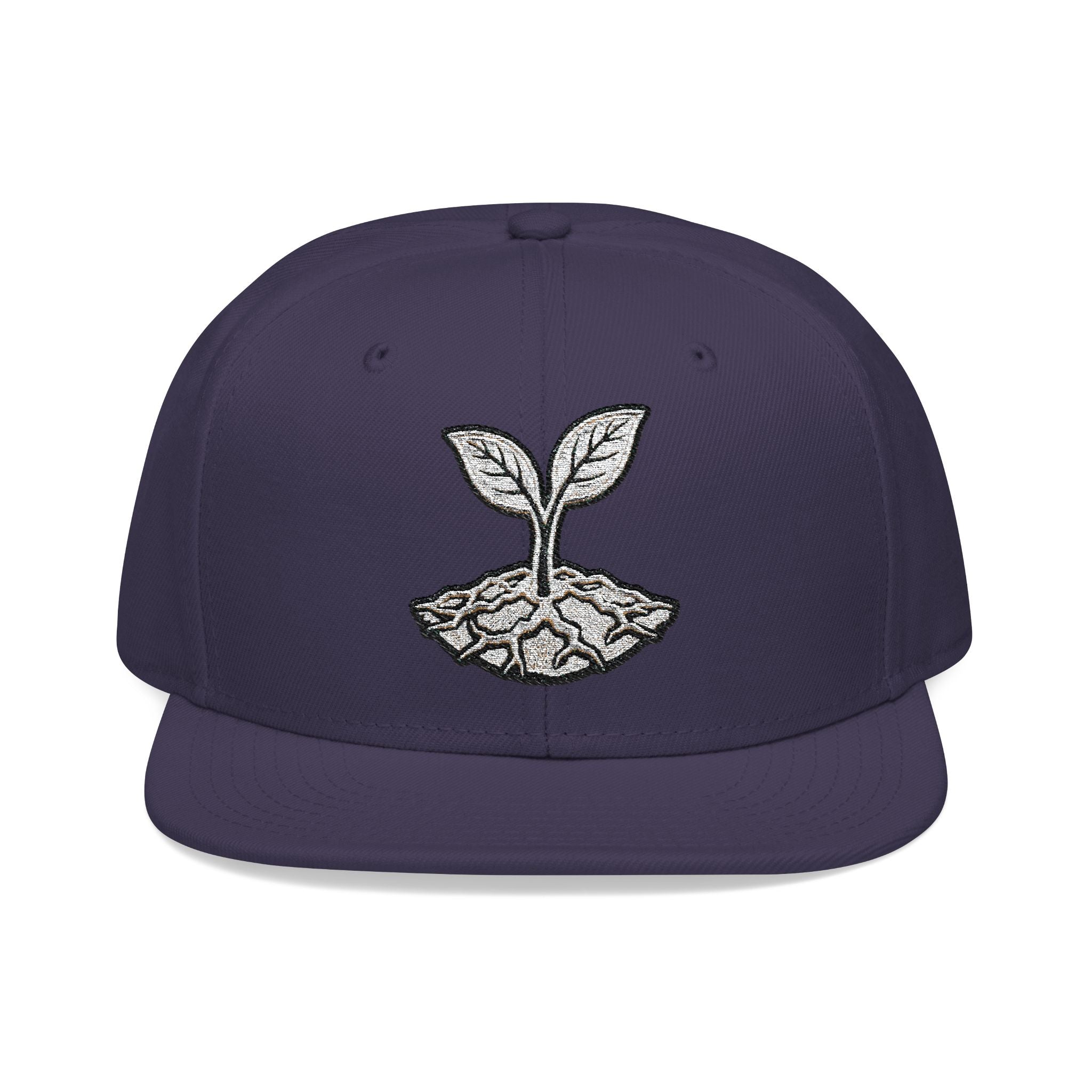 The Living Seed Co. Original Snapback in navy blue — front view showing embroidered seedling mark, Otto Cap flat bill