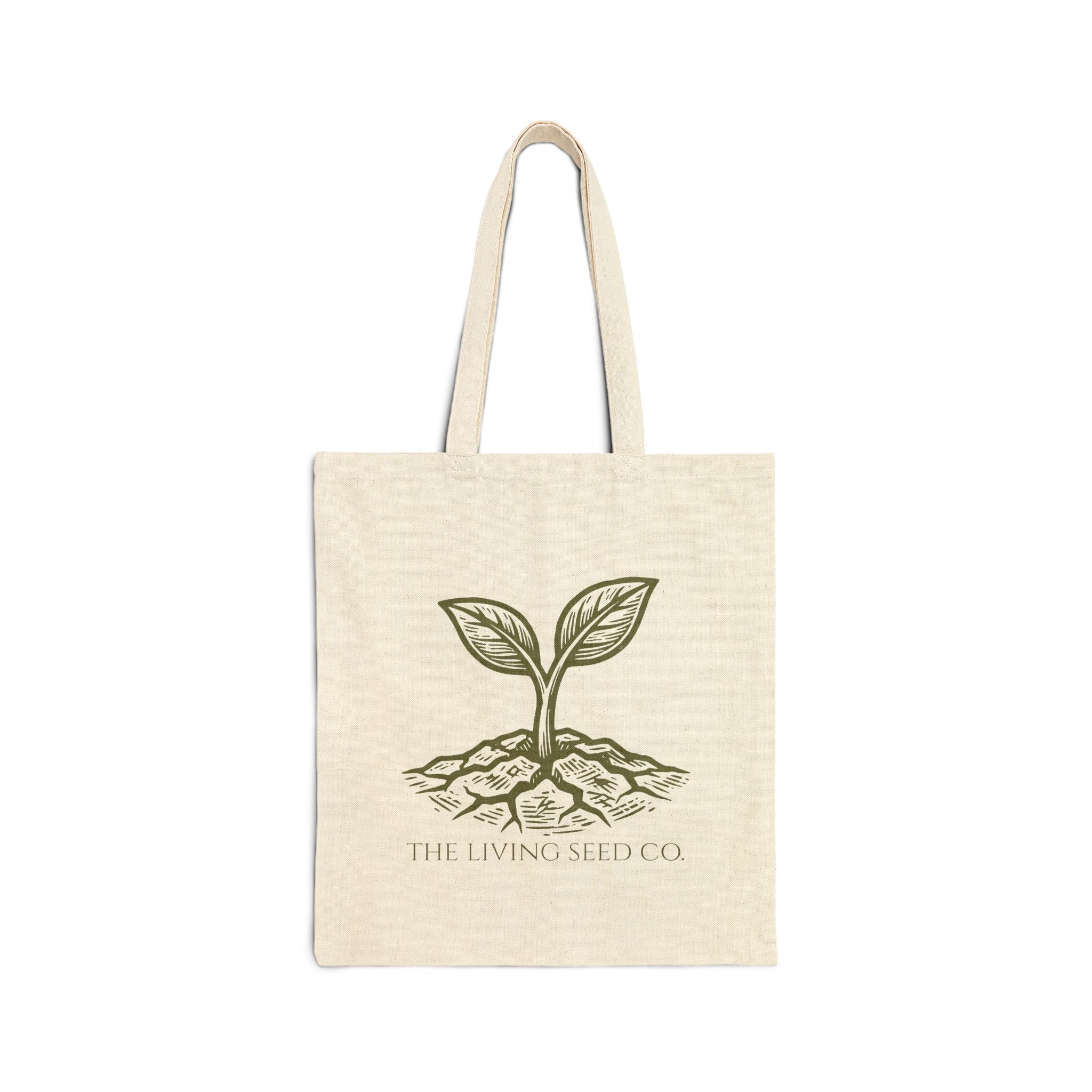 Flat product view of The Original Canvas Tote in Natural showing etching-style sprouting seed graphic and The Living Seed Co. wordmark on 100% cotton canvas