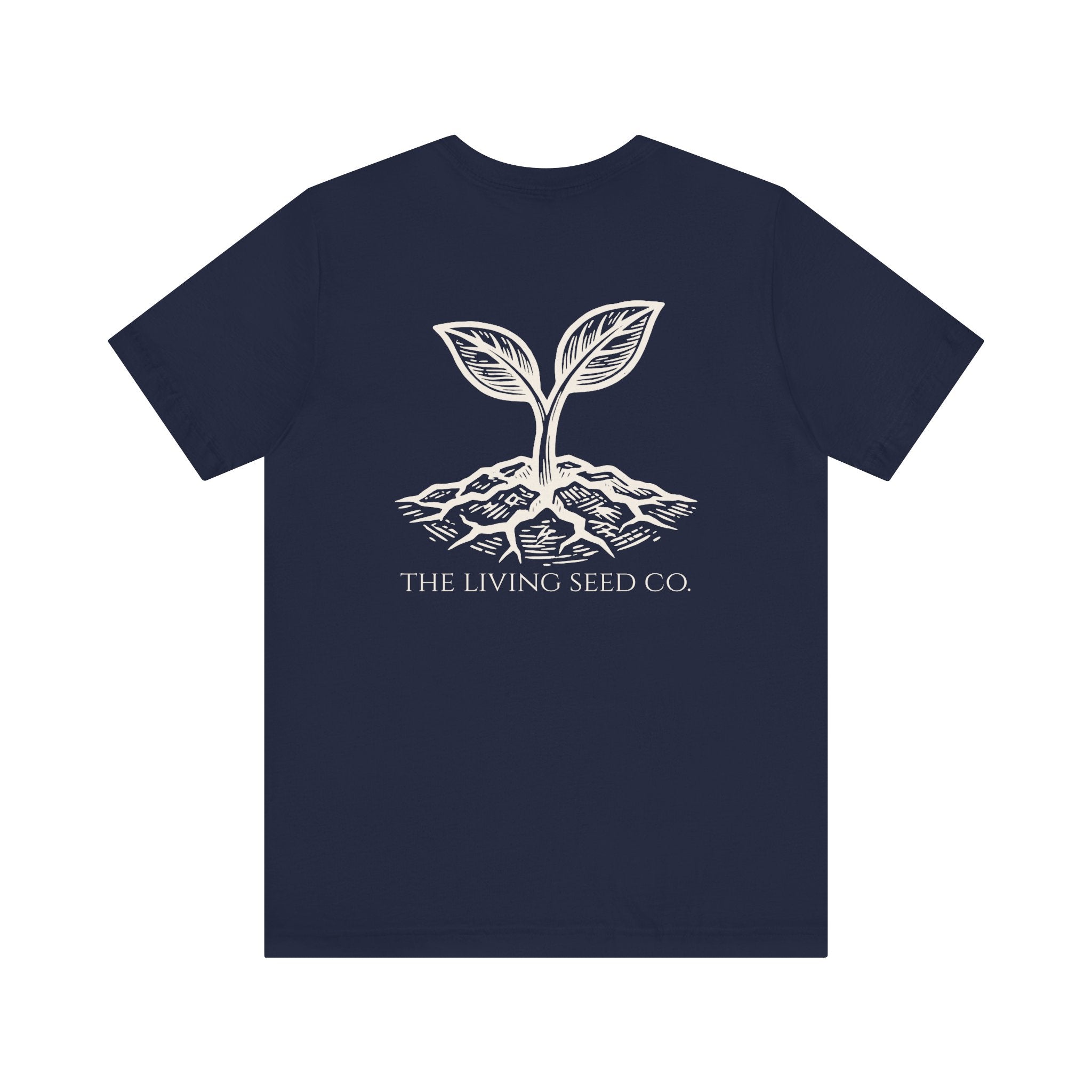 The Original Tee in Navy — back view flat mockup — navy unisex t-shirt featuring The Living Seed Co. etching-style sprouting seed graphic in parchment ink with wordmark below. Bella+Canvas 3001.