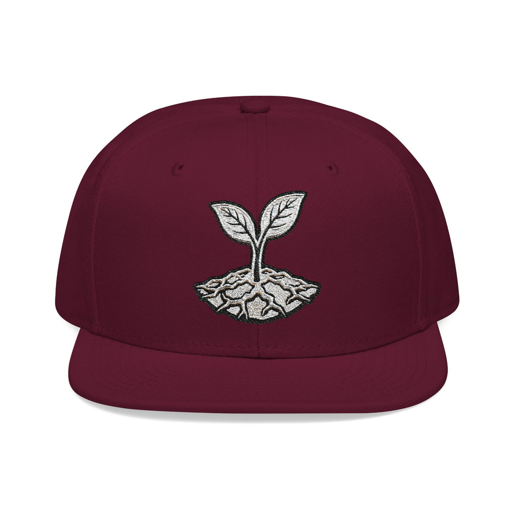 The Living Seed Co. Original Snapback in burgundy maroon — front view showing embroidered seedling mark, Otto Cap flat bill