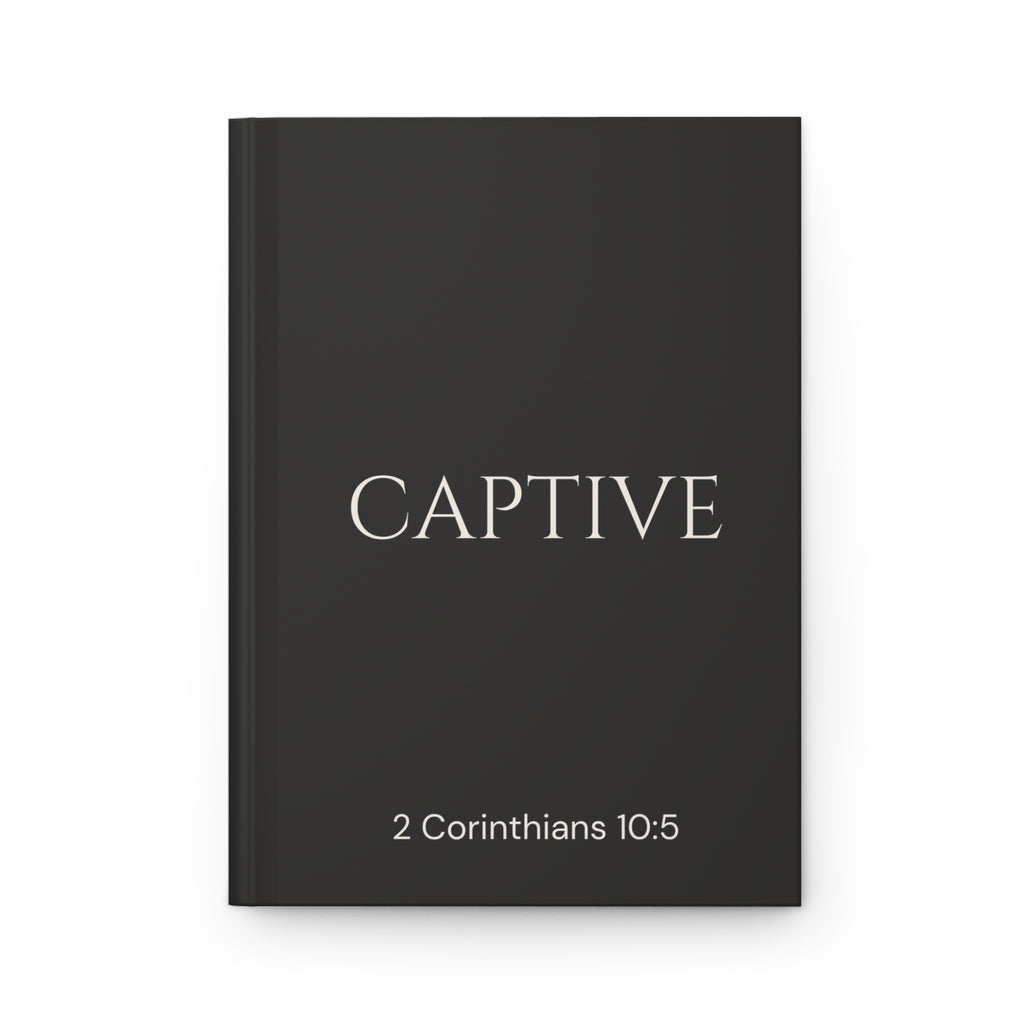 Scripture Series CAPTIVE Journal in Midnight Black — flat mockup — black hardcover journal with CAPTIVE in parchment lettering and 2 Corinthians 10:5 reference.