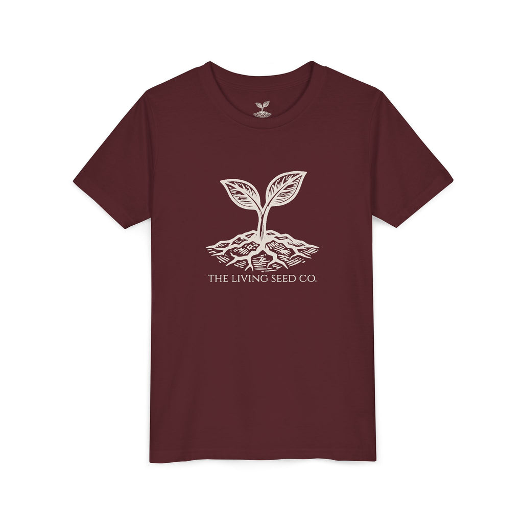 The Original Youth Tee in Maroon — flat mockup — maroon youth t-shirt featuring The Living Seed Co. sprouting seed graphic in parchment ink. Bella+Canvas 3001Y.