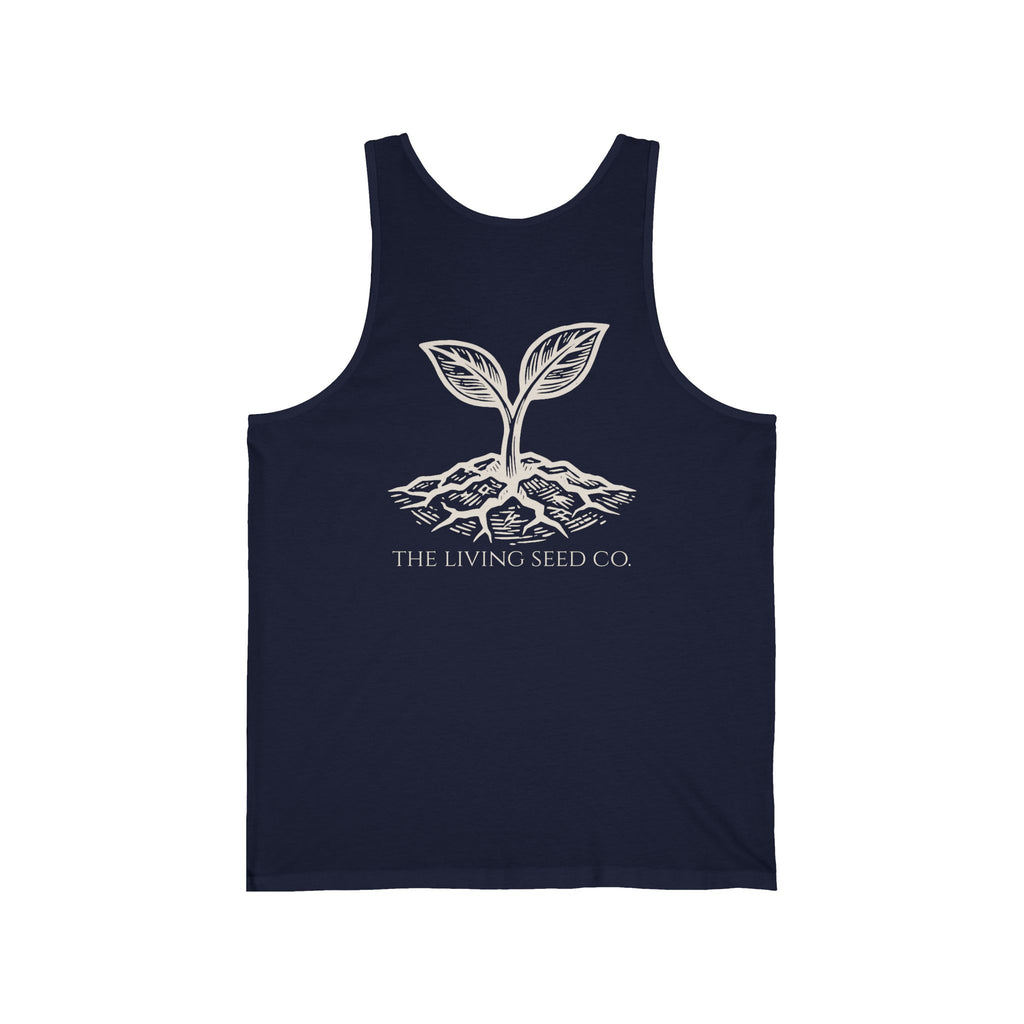 The Original Tank in Navy — back view flat mockup — navy unisex tank top featuring The Living Seed Co. etching-style sprouting seed graphic in parchment ink with wordmark below. Bella+Canvas 3480.