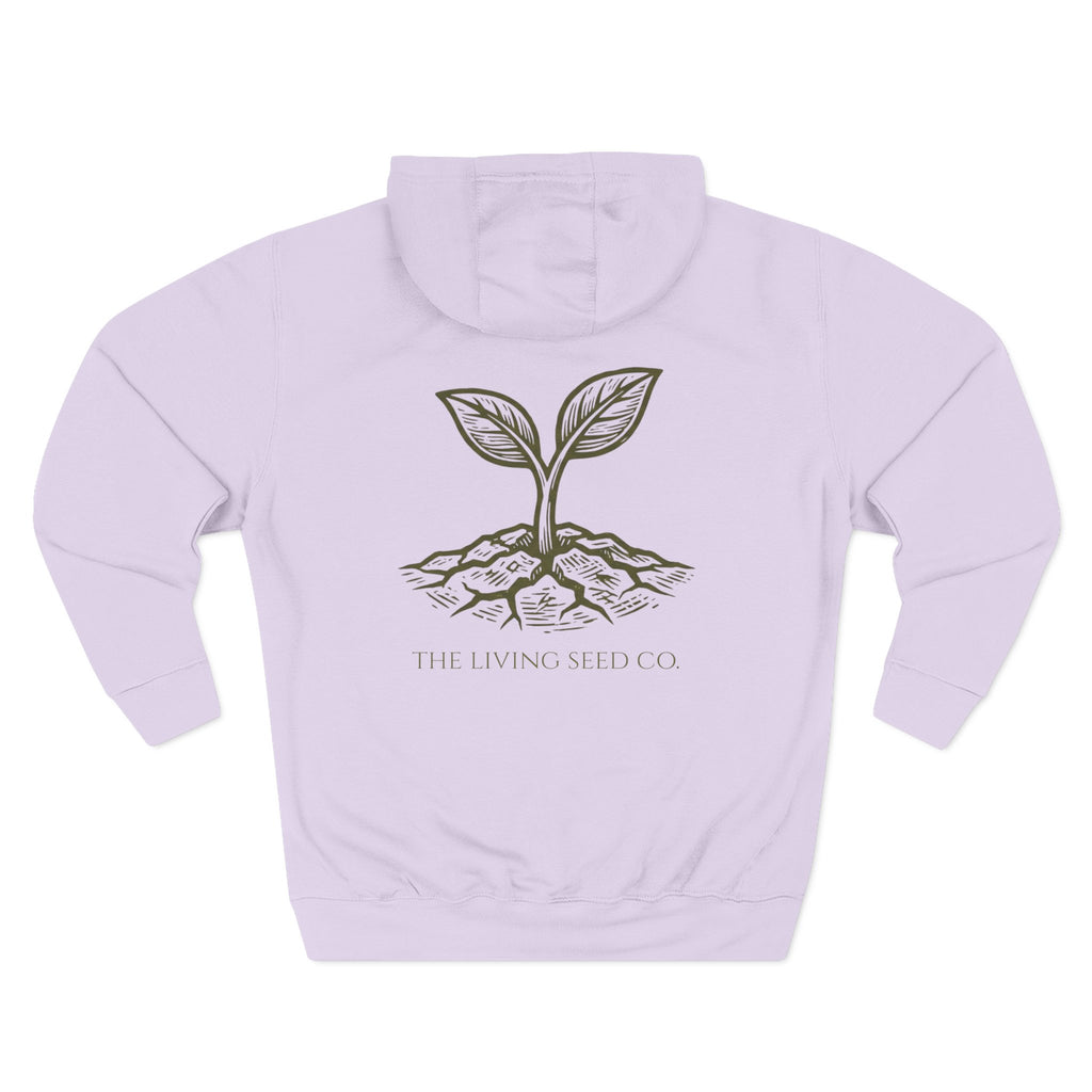 The Original Hoodie (Lane Seven) in Lilac — back view flat mockup — lilac pullover hoodie featuring The Living Seed Co. etching-style sprouting seed graphic in olive ink with wordmark below. Lane Seven LS14001.