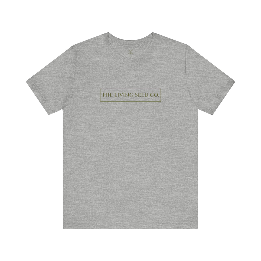 The Original Tee in Athletic Heather — front view flat mockup — grey heather unisex t-shirt featuring The Living Seed Co. boxed wordmark on chest in olive ink. Bella+Canvas 3001.