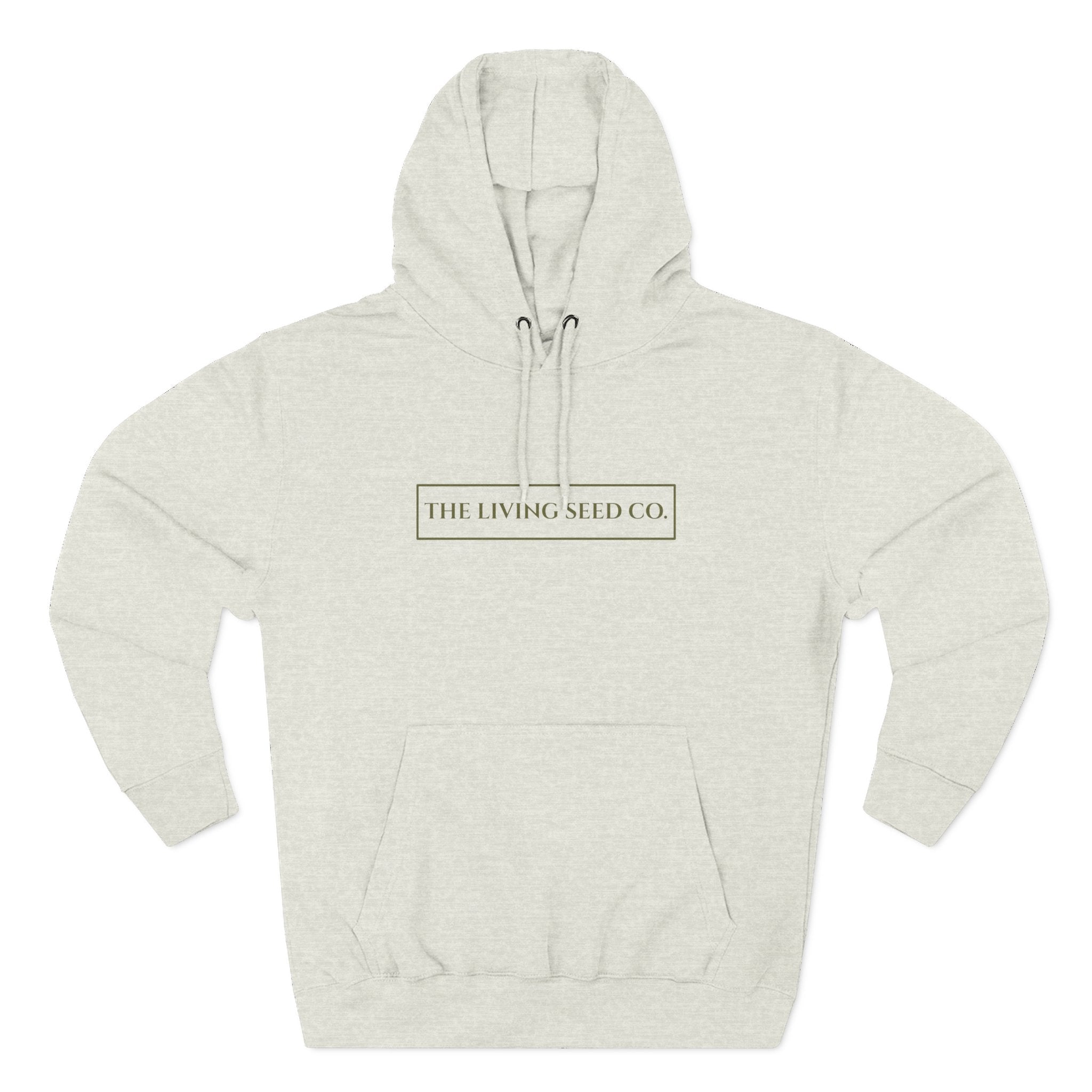 The Original Hoodie (Lane Seven) in Oatmeal Heather — front view flat mockup — oatmeal heather pullover hoodie featuring The Living Seed Co. boxed wordmark on chest in olive ink. Lane Seven LS14001.