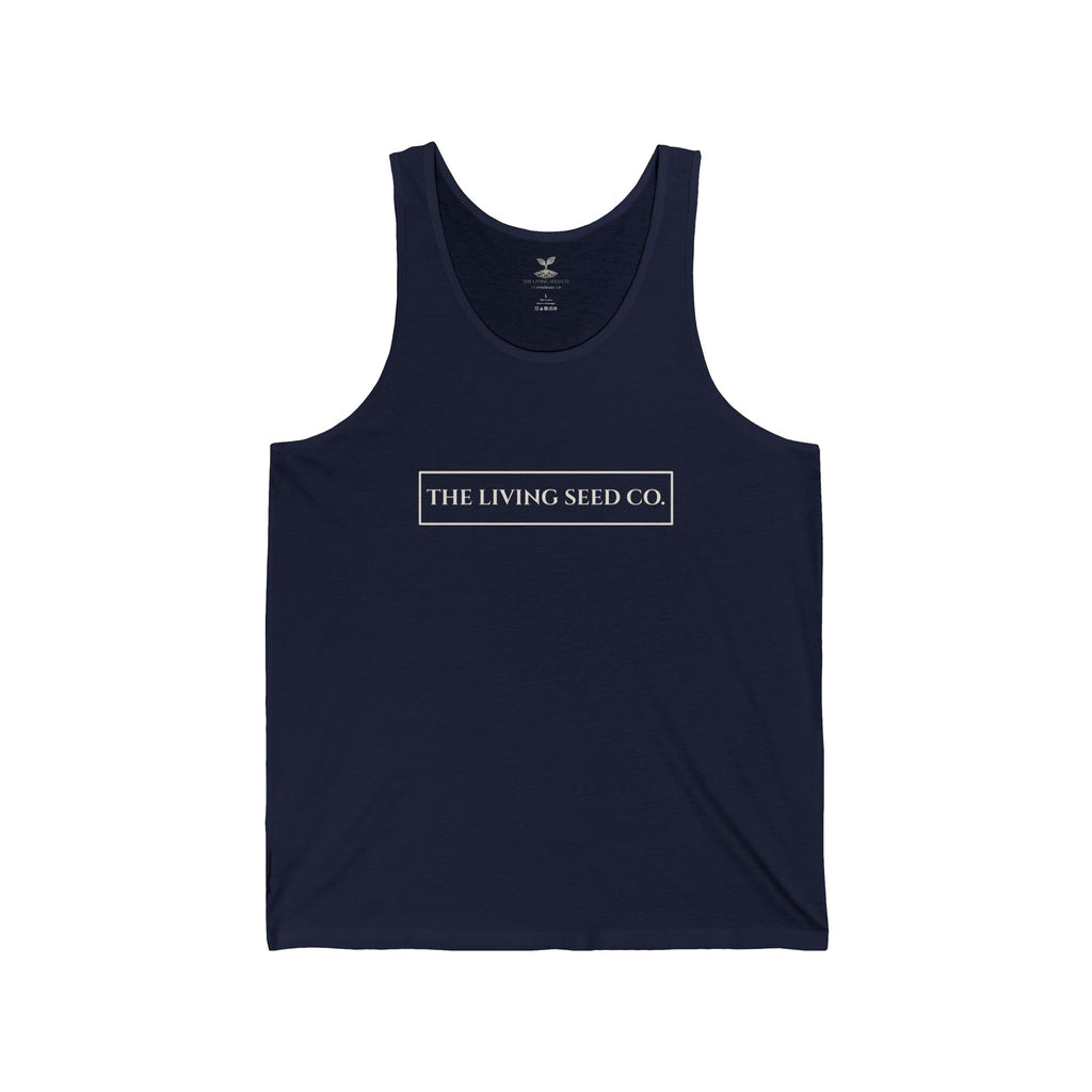 The Original Tank in Navy — front view flat mockup — navy unisex tank top featuring The Living Seed Co. boxed wordmark on chest in parchment ink. Bella+Canvas 3480.