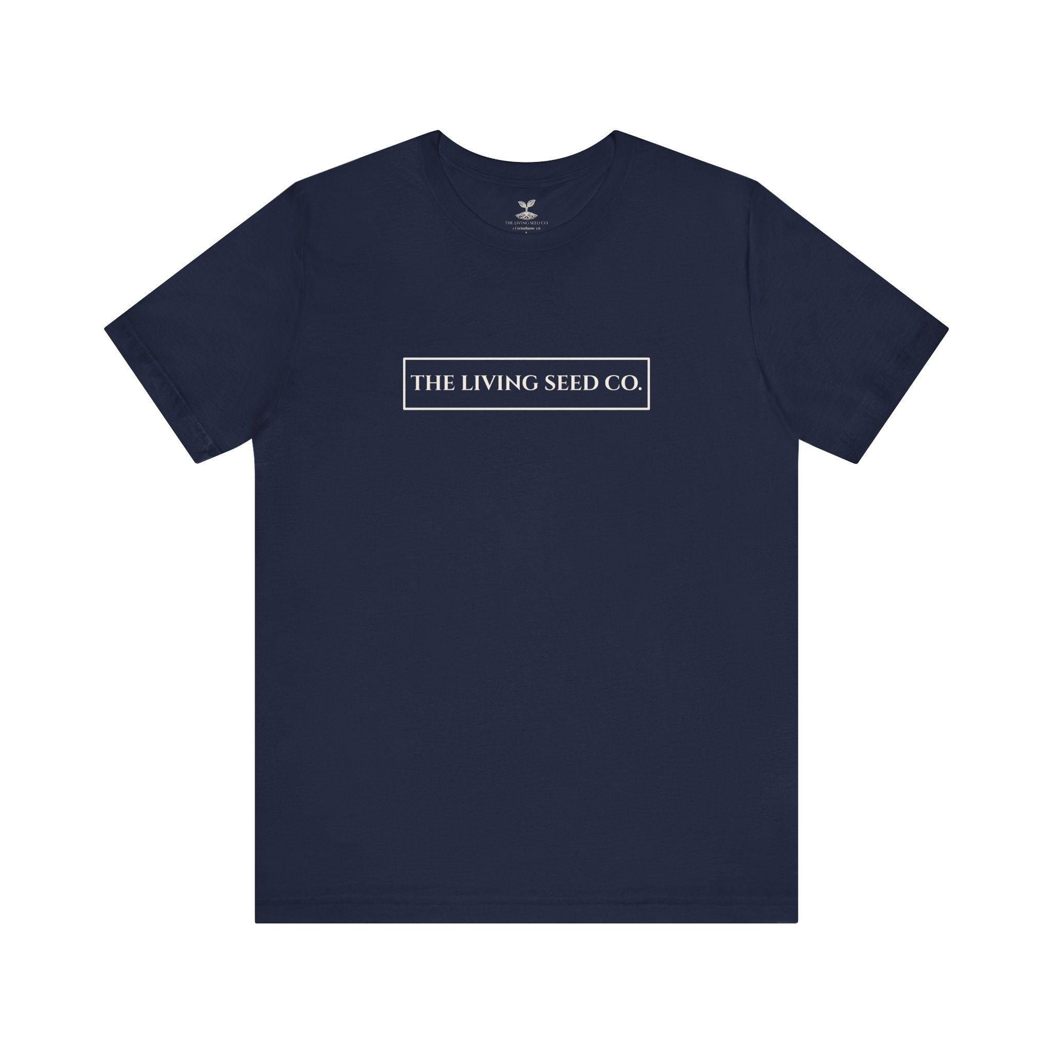 The Original Tee in Navy — front view flat mockup — navy unisex t-shirt featuring The Living Seed Co. boxed wordmark on chest in parchment ink. Bella+Canvas 3001.