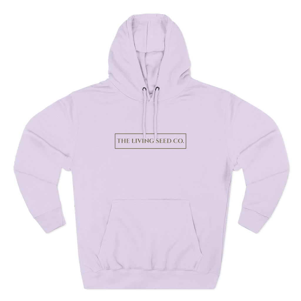 The Original Hoodie (Lane Seven) in Lilac — front view flat mockup — lilac pullover hoodie featuring The Living Seed Co. boxed wordmark on chest in olive ink. Lane Seven LS14001.