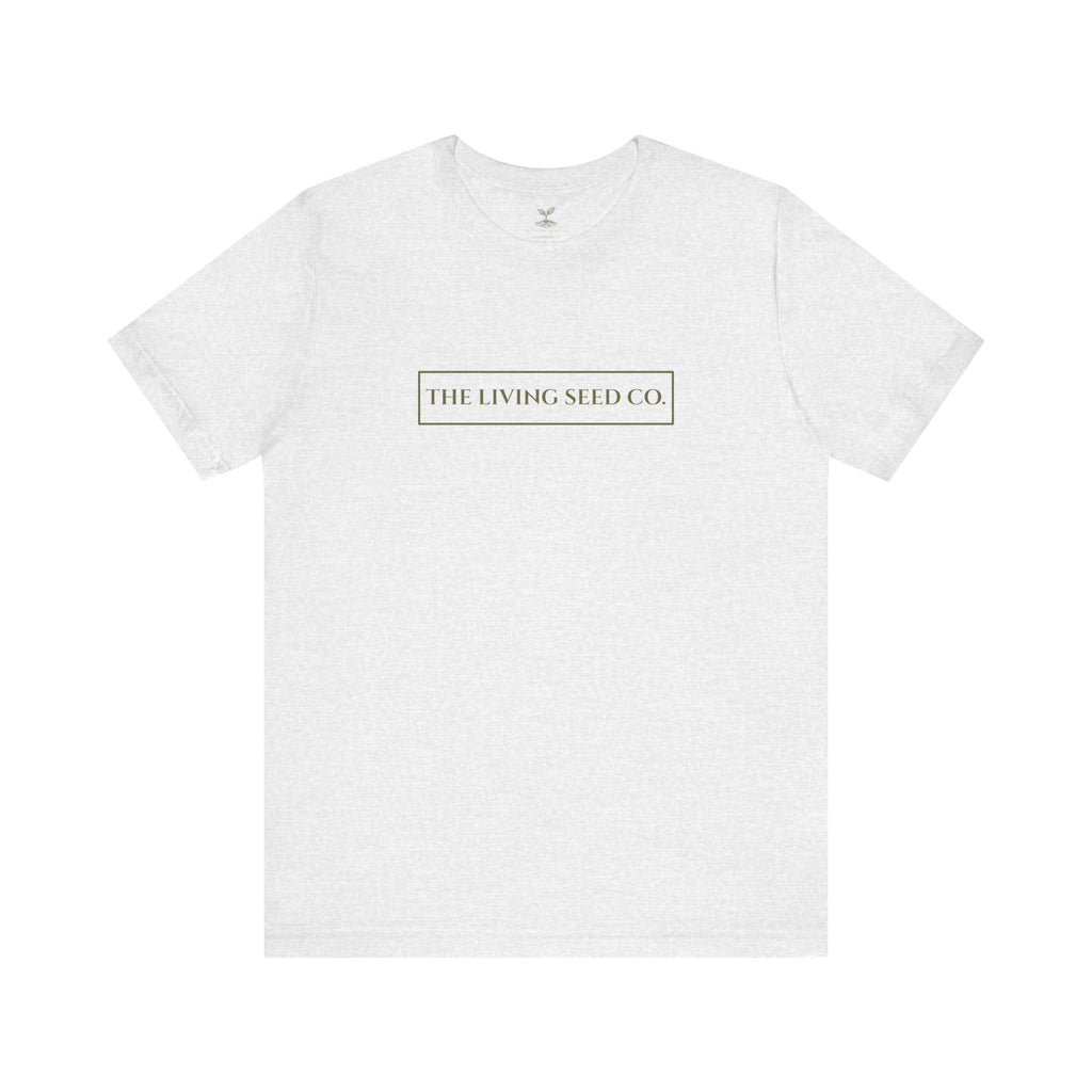 The Original Tee in Ash — front view flat mockup — ash heather unisex t-shirt featuring The Living Seed Co. boxed wordmark on chest in olive ink. Bella+Canvas 3001.