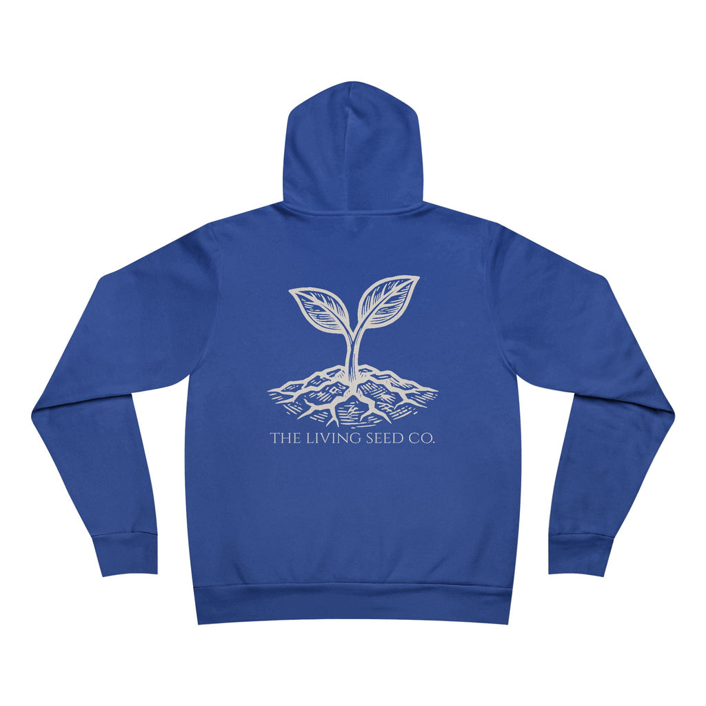The Original Hoodie (Bella+Canvas) in True Royal — back view flat mockup — royal blue unisex pullover hoodie featuring The Living Seed Co. etching-style sprouting seed graphic in parchment ink with wordmark below. Bella+Canvas 3719.