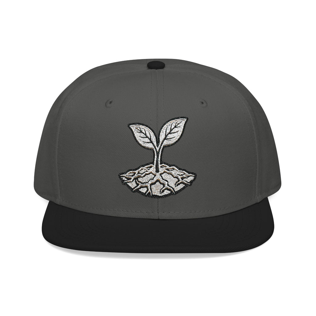 The Living Seed Co. Original Snapback in black and charcoal gray — front view showing embroidered seedling mark, Otto Cap flat bill