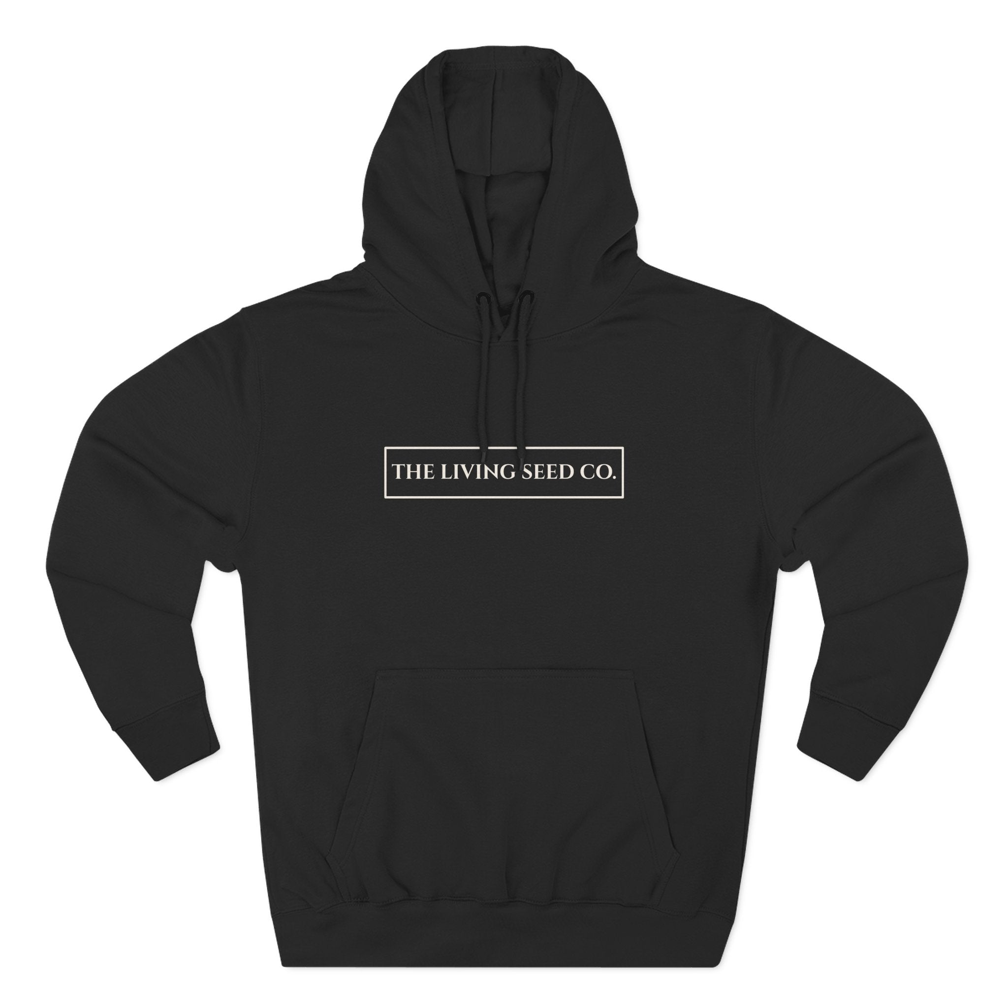 The Original Hoodie (Lane Seven) in Black — front view flat mockup — black pullover hoodie featuring The Living Seed Co. boxed wordmark on chest in parchment ink. Lane Seven LS14001.