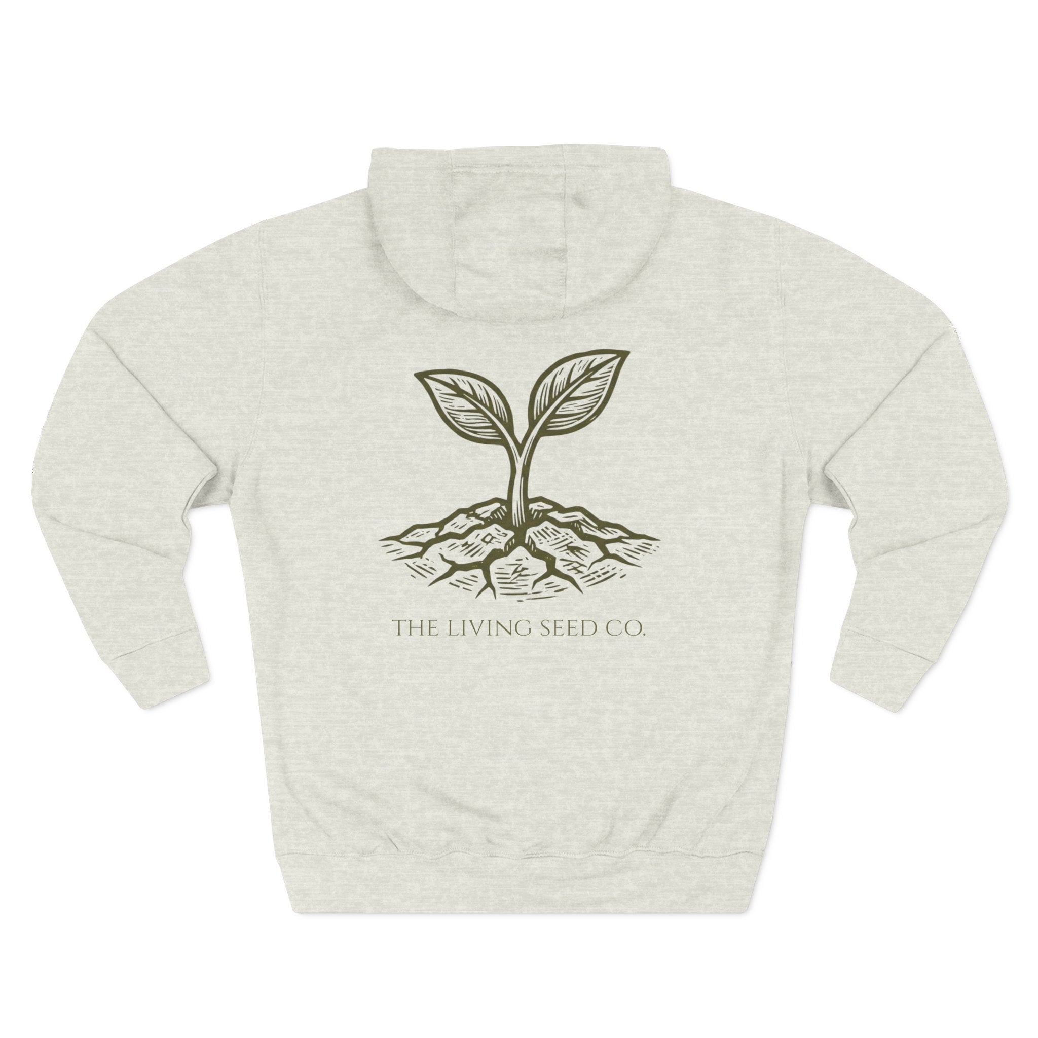 The Original Hoodie (Lane Seven) in Oatmeal Heather — back view flat mockup — oatmeal heather pullover hoodie featuring The Living Seed Co. etching-style sprouting seed graphic in olive ink with wordmark below. Lane Seven LS14001.