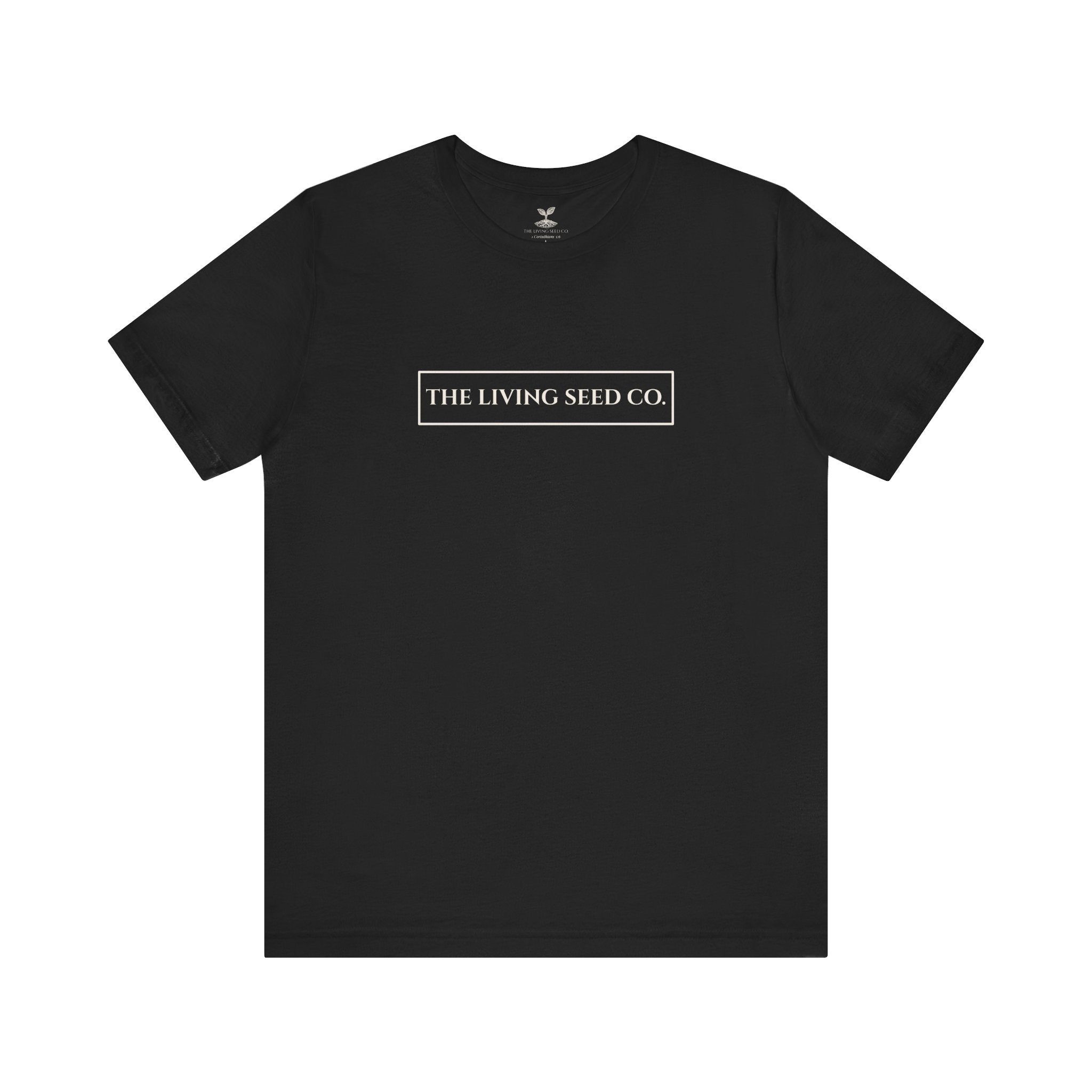 The Original Tee in Black — front view flat mockup — black unisex t-shirt featuring The Living Seed Co. boxed wordmark on chest in parchment ink. Bella+Canvas 3001.
