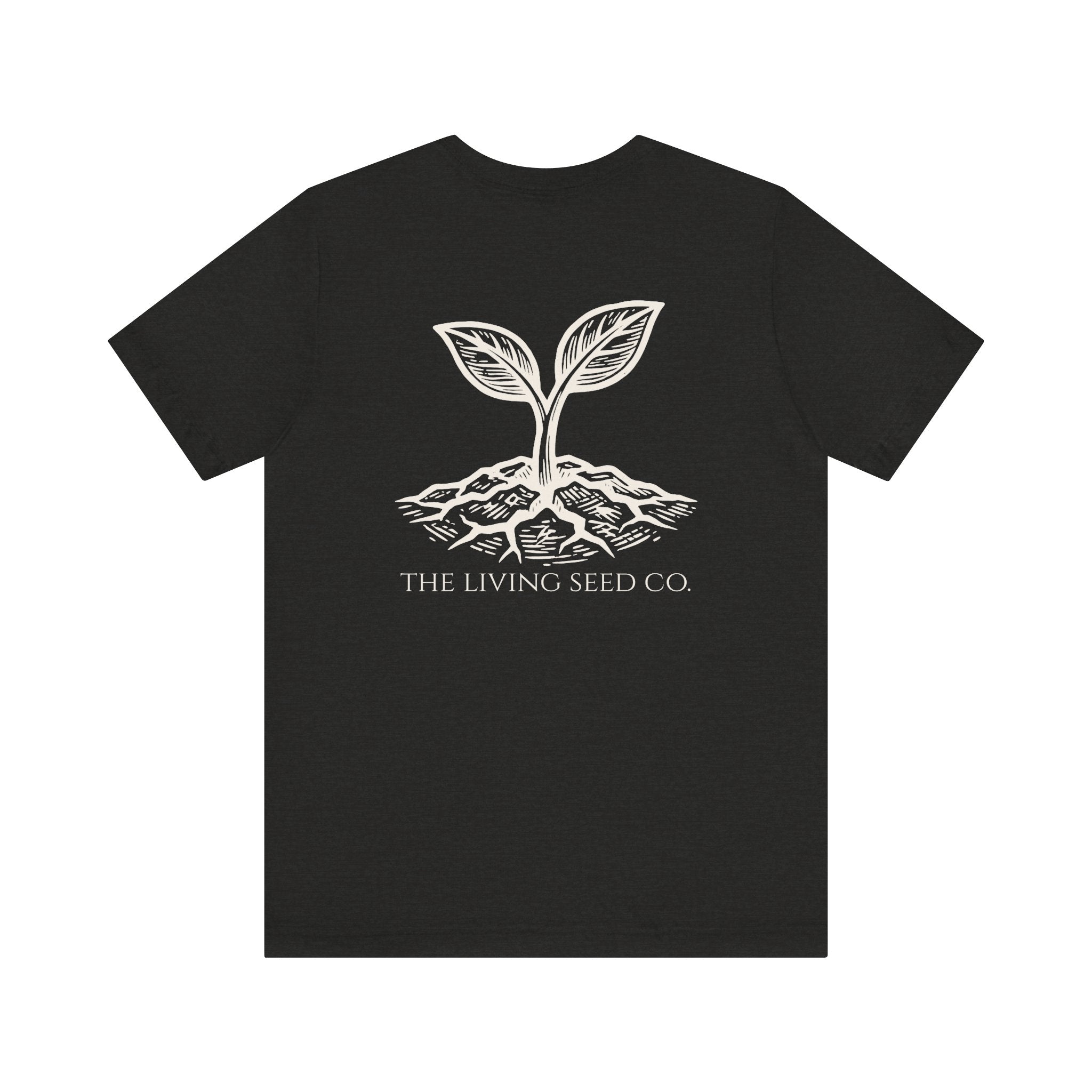 The Original Tee in Black Heather — back view flat mockup — dark grey unisex t-shirt featuring The Living Seed Co. etching-style sprouting seed graphic in parchment ink with wordmark below. Bella+Canvas 3001.