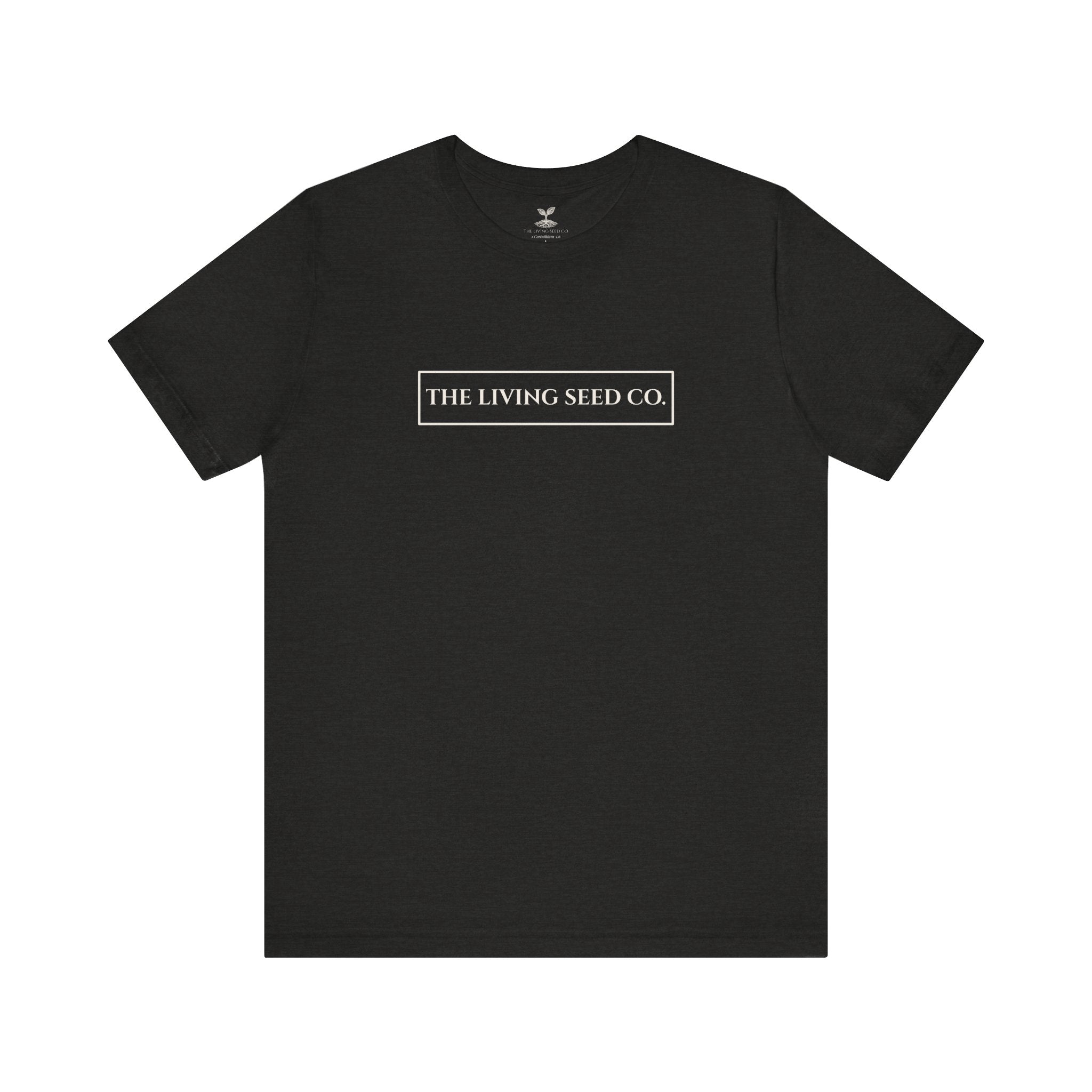 The Original Tee in Black Heather — front view flat mockup — dark grey unisex t-shirt featuring The Living Seed Co. boxed wordmark on chest in parchment ink. Bella+Canvas 3001.